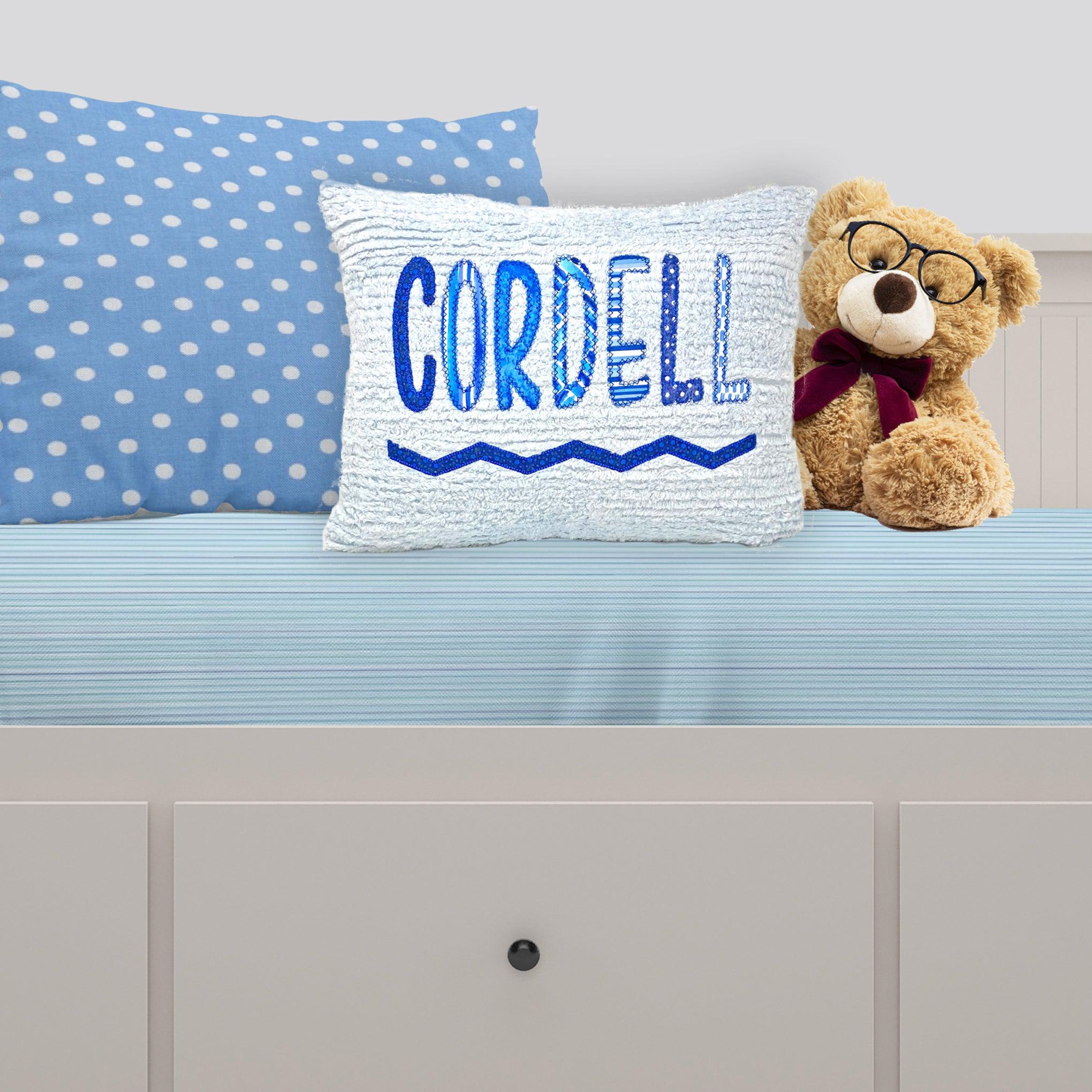 Adorable bule chenille pillow with applique name in blue prints. Kids love personalized items.