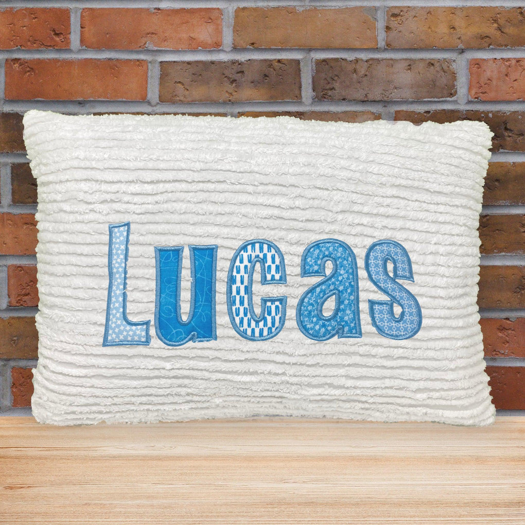 name pillow for boy or girl, white chenille fabric with multiple light blue print fabric applique letters