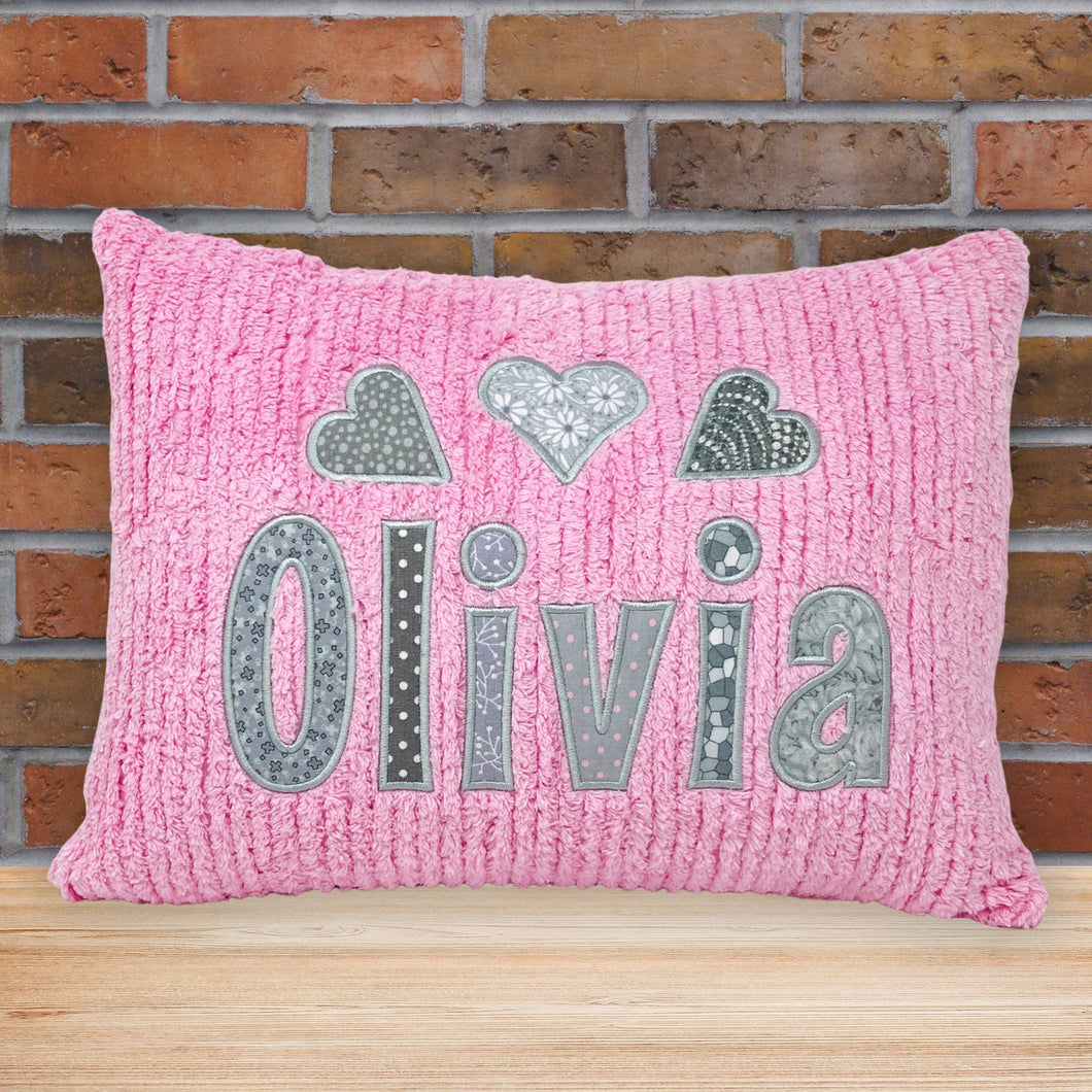 name pillow for girls, pink or white chenille fabric with multiple light gray print fabric applique letters and hearts