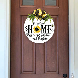 wood wreath with yellow plaid and black bow and greenery. Bless this home with love and laughter. Bees and sunflower
