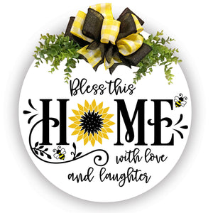 wood wreath with yellow plaid and black bow and greenery. Bless this home with love and laughter.  Bees and sunflower