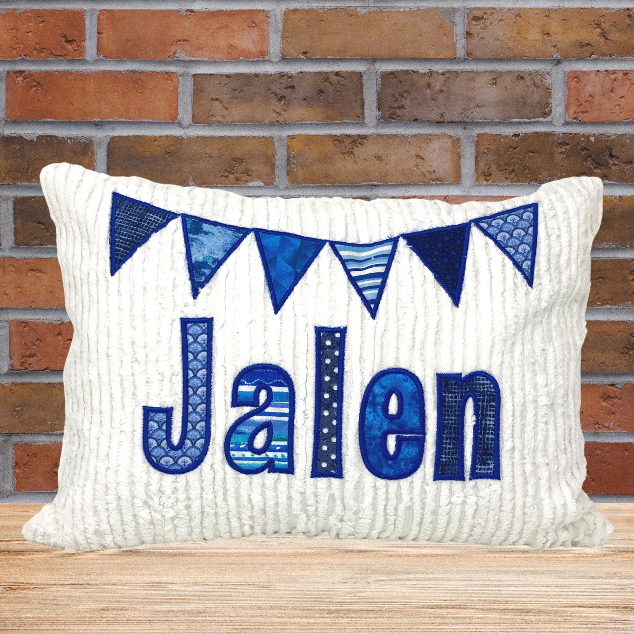 personalized pillow for boy- medium to dark blue applique name and flags