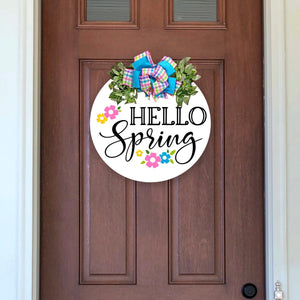 painted wood wreath with Hello Sprint and flowers. pastel plaid and turquoise bow and greenery. 18 inches round solid wood